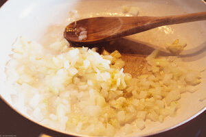 In a skillet, heat 1 tablespoon (15 ml) of the oil over medium-high heat. Add the onion and fry, stirring from time to time, for 5 to 7 minutes, or until soft and translucent, then add the garlic and fry for another 30 seconds, or until fragrant. Transfer to a large bowl.