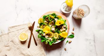 A colorful summer salad with tofu feta & edible flowers