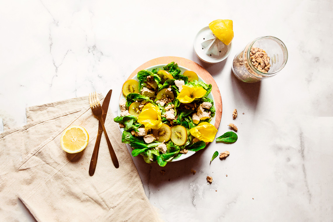 A colorful summer salad with tofu feta & edible flowers